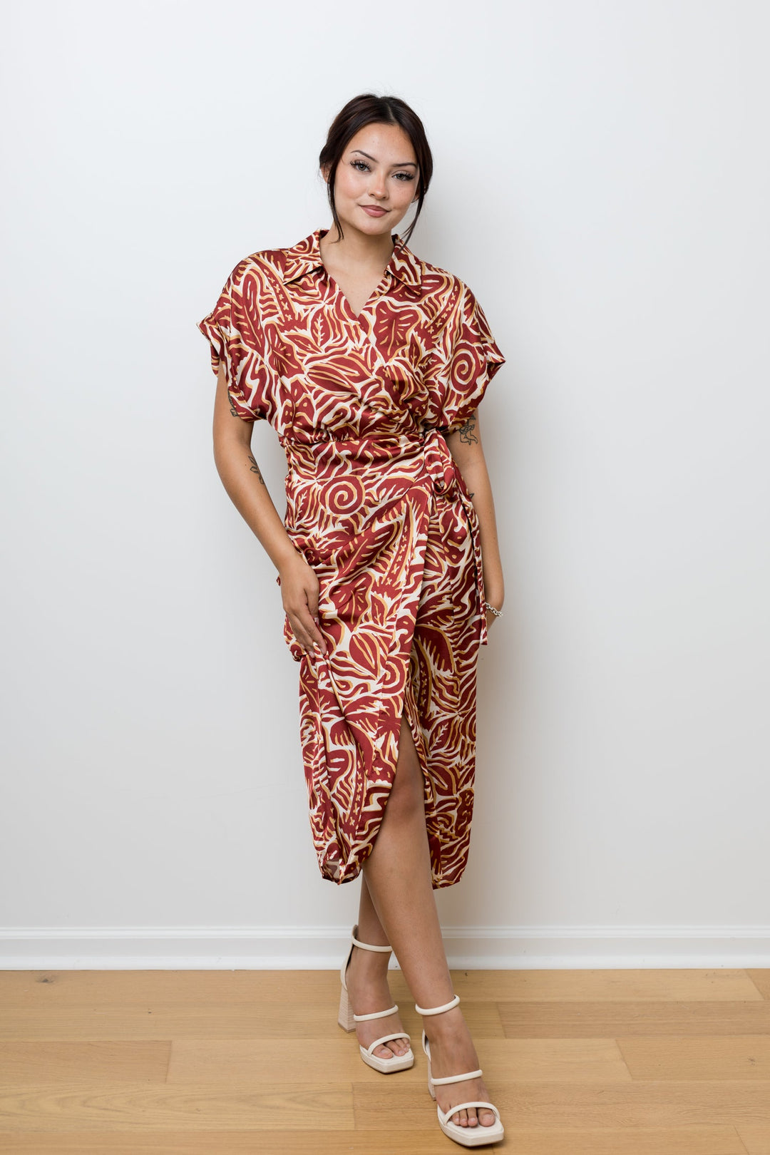 The Taking Chances Rust Palm Satin Wrap Dress