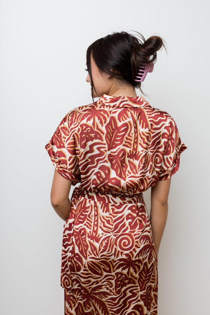 The Taking Chances Rust Palm Satin Wrap Dress